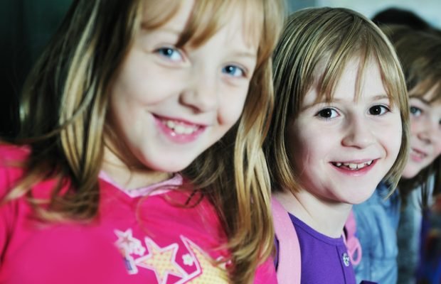 happy childrens group in schoold have fun and learning leassos